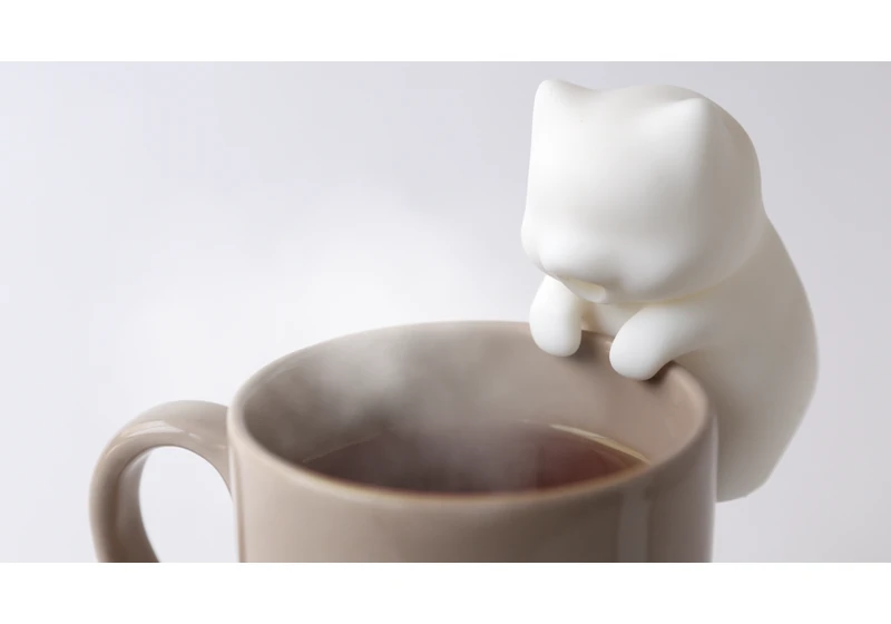  This adorable little robot cat will stop you burning your tongue on hot coffee 